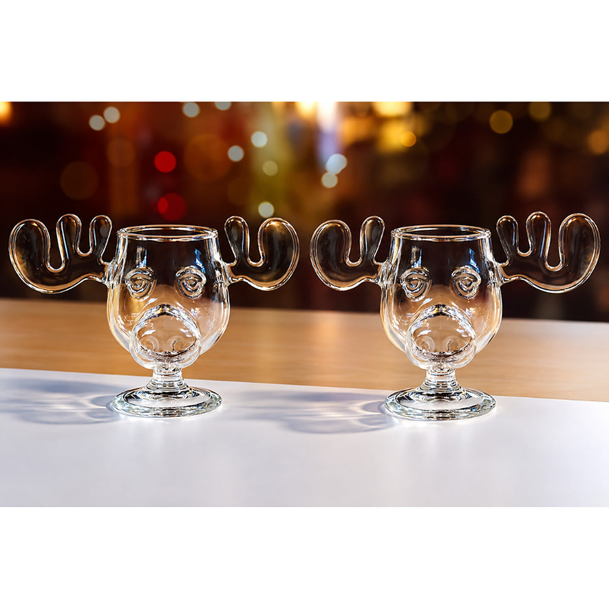 Twee glazen kerstmokken met elandkop